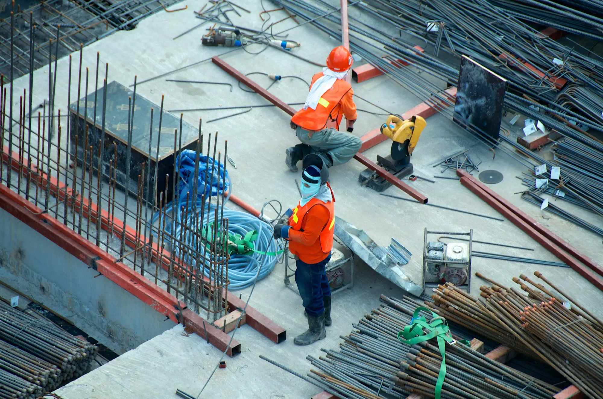 Construction project with workers, safety equipment, and jobsite supplies